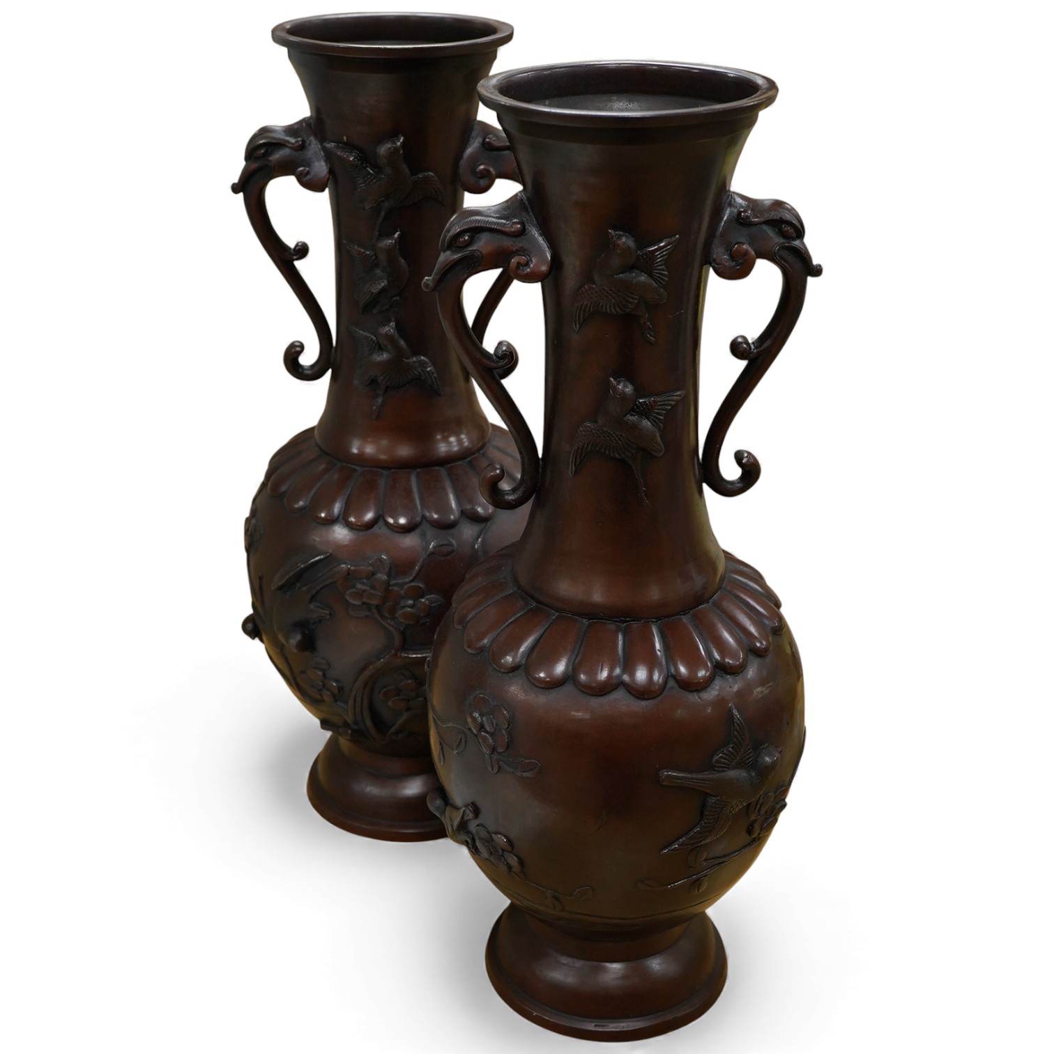 A large pair of Japanese bronze vases, early 20th century, decorated in relief with birds and flowers, 45cm high